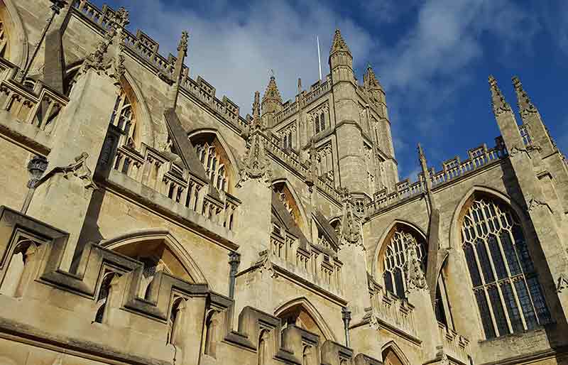 Gothic architecture and yellow stone of the exterior.