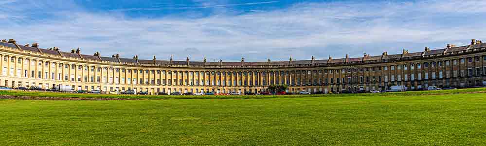 Full width of the buildings of yellow Bath stone.
